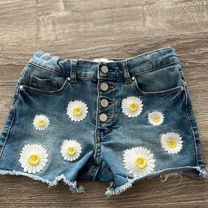 Jean shorts,brand JORDACHE,size 7Y, color, blue jeans with daisies